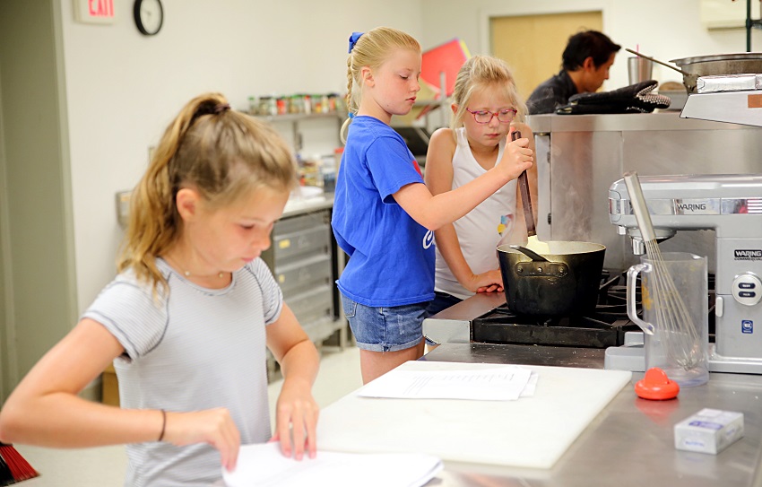 Children enrolled in the Kids Culinary Camp at East Mississippi Community College’s Lion Hills Center prepare a dish. Children enrolled in the Kids Culinary Camp at East Mississippi Community College’s Lion Hills Center prepare a dish.